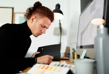 Male architect working at home office