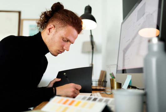Male architect working at home office