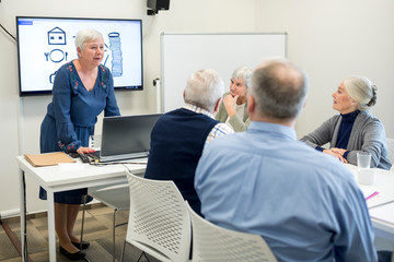 Senior instructor holding course on bool keepinf for seniors