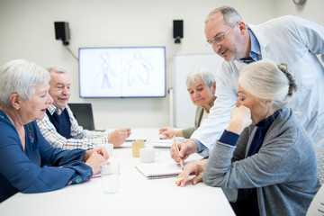 Group of active seniors attending seniors education course