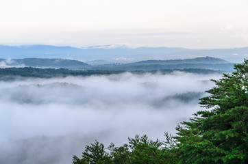 fog in the valley below a scenic overlook along the skyway motorway in the talladega national forest, alabama, usa