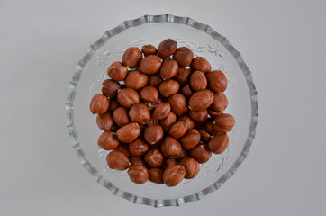 Hazelnuts on a white background. 