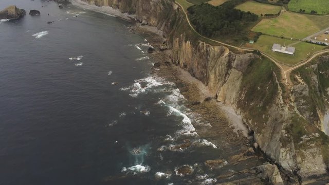 Coast in Asturias,Spain. Beach and cliffs in Busto Cape. Aerial Drone Footage