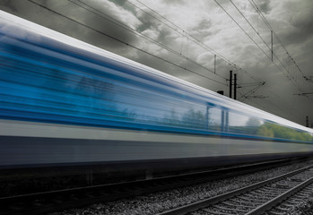 Train in movement by rail with a blue sky