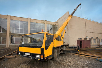 Big Power Mobile Crane on a road and tower crane in construction site