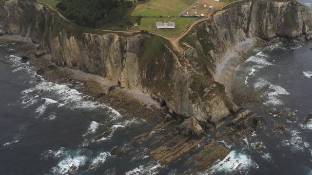 Coast in Asturias,Spain. Beach and cliffs in Busto Cape. Aerial Drone Footage