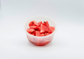 VIEW OF WATERMELON PIECES IN A PLASTIC BOWL