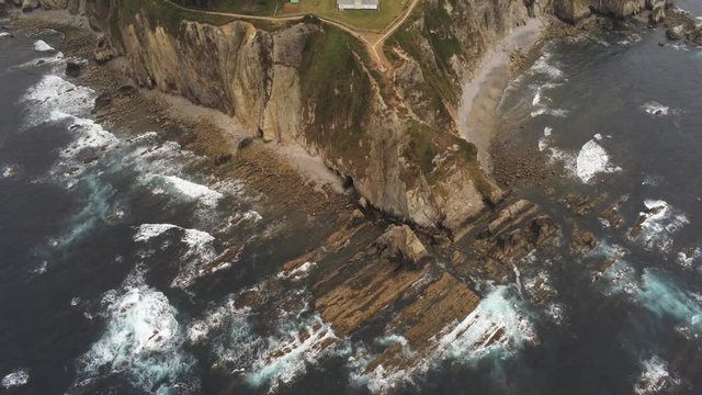 Coast in Asturias,Spain. Beach and cliffs in Busto Cape. Aerial Drone Footage