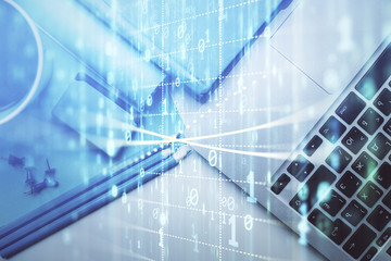 Multi exposure of data drawing hologram over topview of study desk background with computer. Concept of technology.