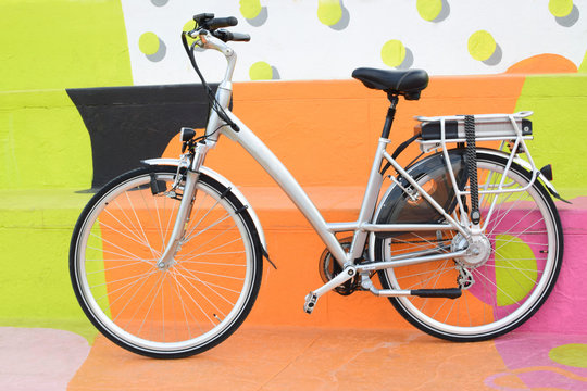 electric bicycle on the colourful background, e-bike, city bike