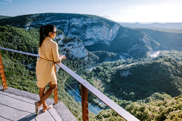 woman on vacation in the Ardeche France Pont d Arc, Ardeche France,view of Narural arch in Vallon Pont D'arc in Ardeche canyon in France Europe - obrazy, fototapety, plakaty