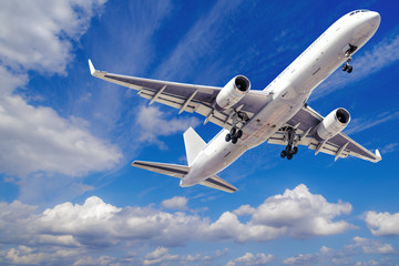 Fototapeta na wymiar modern airliner takes off into a blue sky