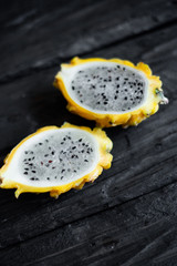 yellow pitahaya dragon fruit on wooden background