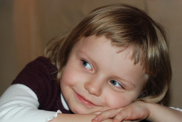 Girl laying on hands and listening concentrated and attentively