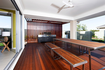 A modern backyard kitchen with outside grill