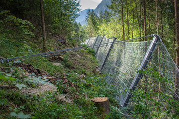 Protective metal mesh against falling rocks from the mountains.Active rockfall barrier system.Landslide protection.