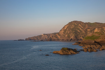 Fototapeta premium View from the Capstone Hill towards Beacon Point at sunset, Ilfracombe, Devon, UK