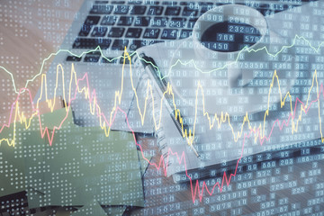 Double exposure of forex chart drawing and desktop with coffee and items on table background. Concept of financial market trading