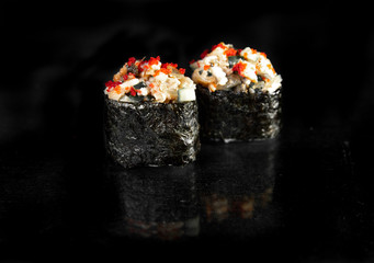 rolls with reflection on a black background. quality photos for menu design and templates.