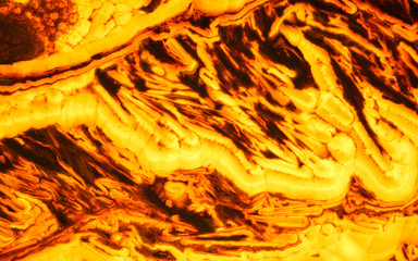 Lava like yellow marble onyx texture. Backlit texture detail