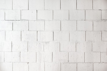 White painted wall of rough bare stones, background texture for architecture, construction site and house building, copy space