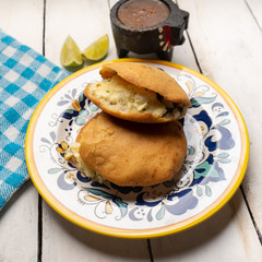 Mexican fried gorditas style michoacan with cheese on white background