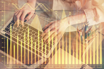 Double exposure of woman hands typing on computer and forex chart hologram drawing. Stock market invest concept.