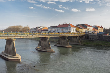 Obraz premium Old pedestrian bridge over Uzh river in Uzhhorod, Ukraine