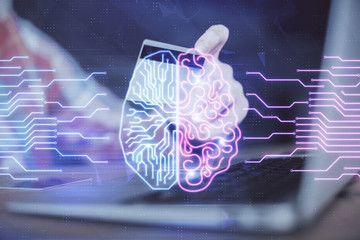 Double exposure of man hands typing on computer with credit card and brain theme drawing....