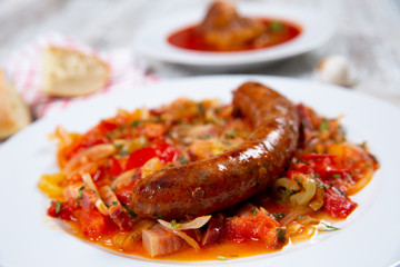 Sausage with vegetables on a plate