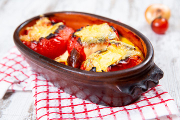 Stuffed tomatoes. Tomatoes baked with cheese and meat