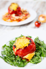 Stuffed tomatoes. Tomatoes baked with cheese and meat