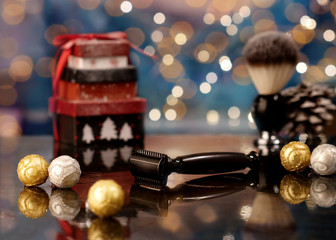 Razor on on the icy surface among Christmas decoration on the background of bokeh