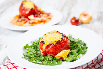 Stuffed tomatoes. Tomatoes baked with cheese and meat