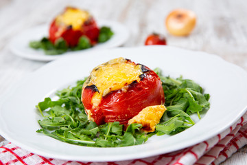 Stuffed tomatoes. Tomatoes baked with cheese and meat