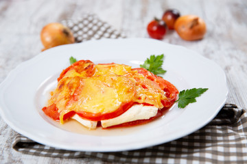 Sliced tomatoes and cheese and baked