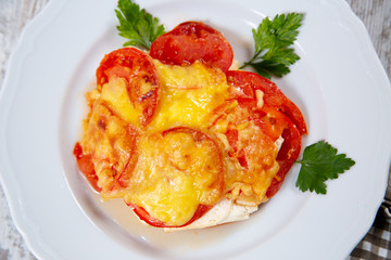 Sliced tomatoes and cheese and baked
