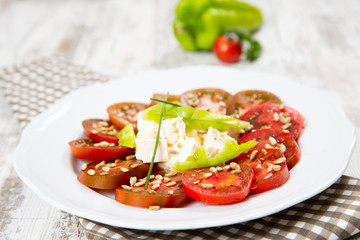 Salad tomato with cheese and paprika
