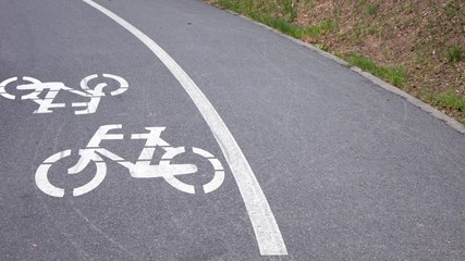 Obraz premium Painted marking of a bicycle path in a small Polish town.