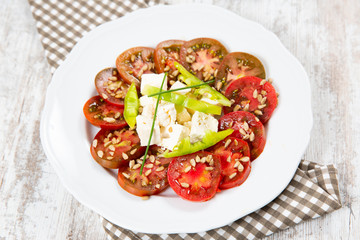 Salad tomato with cheese and paprika