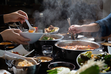 two people sharing hotpot