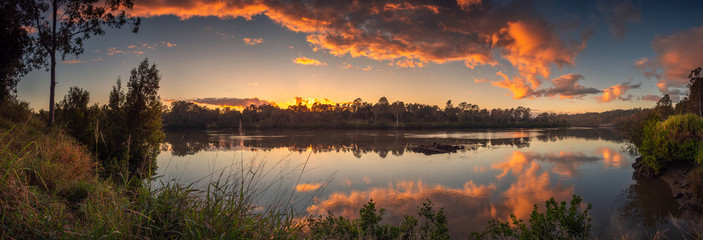 Beautiful Panoramic Riverside Sunrise with Reflections