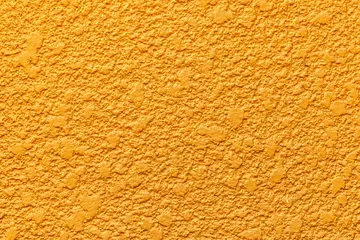 Fotobehang Patterned cement wall Vintage yellow painted texture and background © torsakarin