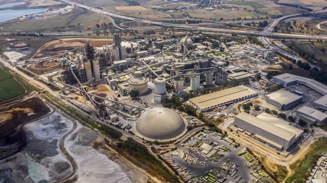 Aerial view on a huge heavy industrial factory complex at Nesher, Israel, drone 4k