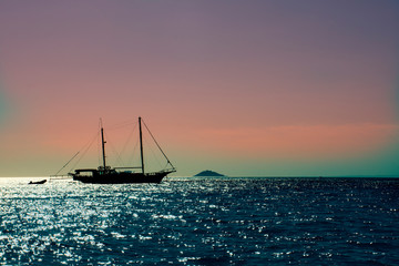 
Sailing ship sails at sunset