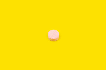 Pink pill on yellow background. Pink pill on orange background. Yellow seamless pattern and pink pill.