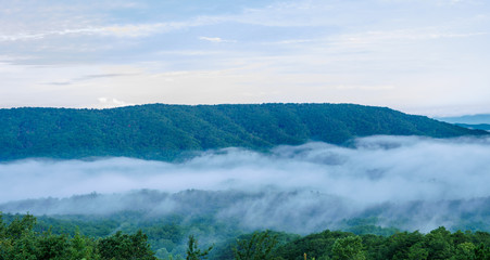 fog in the valley below a scenic overlook along the skyway motorway in the talladega national forest, alabama, usa