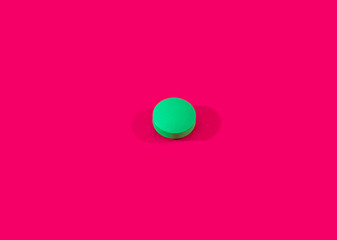 Green pill on pink background. Lettuce pill on red background. Pink  tablet seamless pattern.