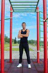 sports man in the morning on the city sports field