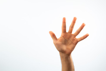 hand waving on a white background with high key effect